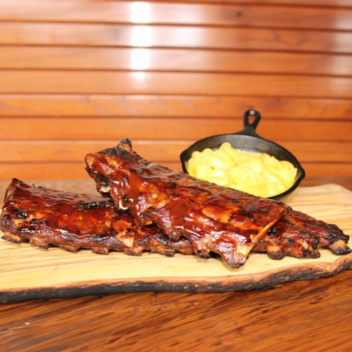 One half rack of baby back ribs