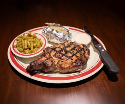Smoked Pork Chop with side of green beans and baked potato
